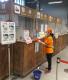 Image 4. Disinfecting the check-in station in the Port of Keelung West Terminal building with diluted chlorine bleach.(JPG)