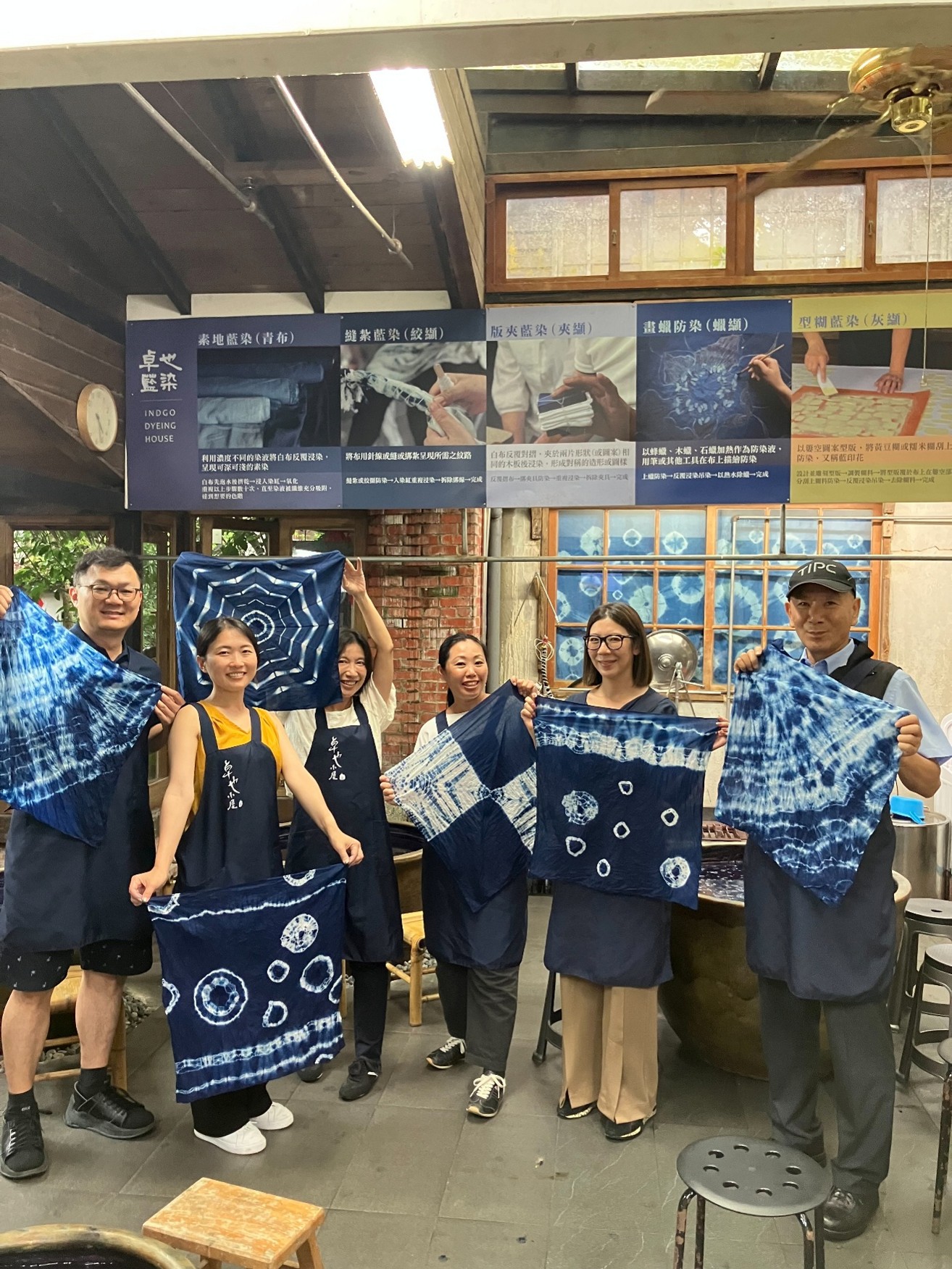 Image 4. Delegation members try their hand at a local indigo dyeing experience, create one-of-a-kind works of indigo art